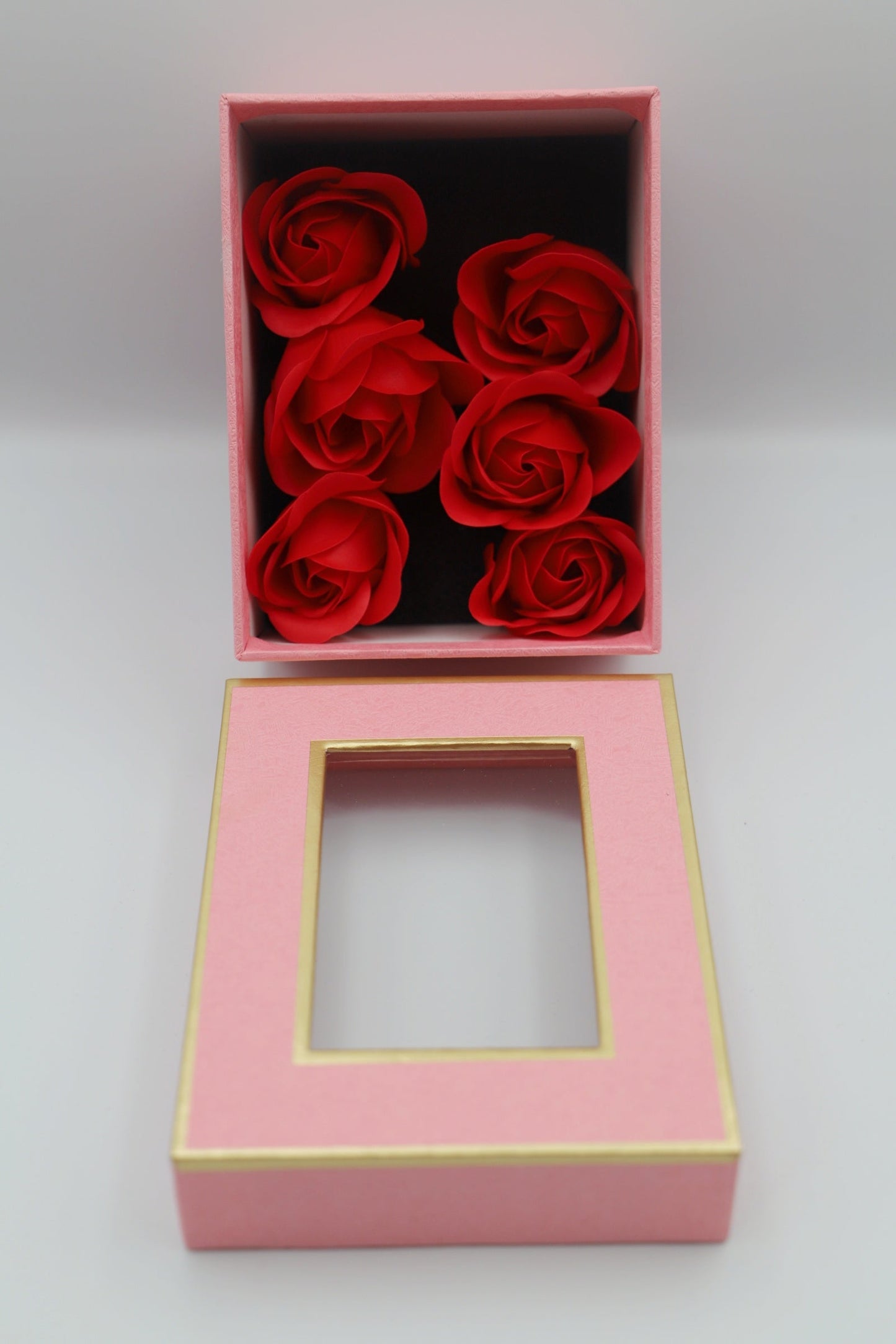 Pink gift box red petals