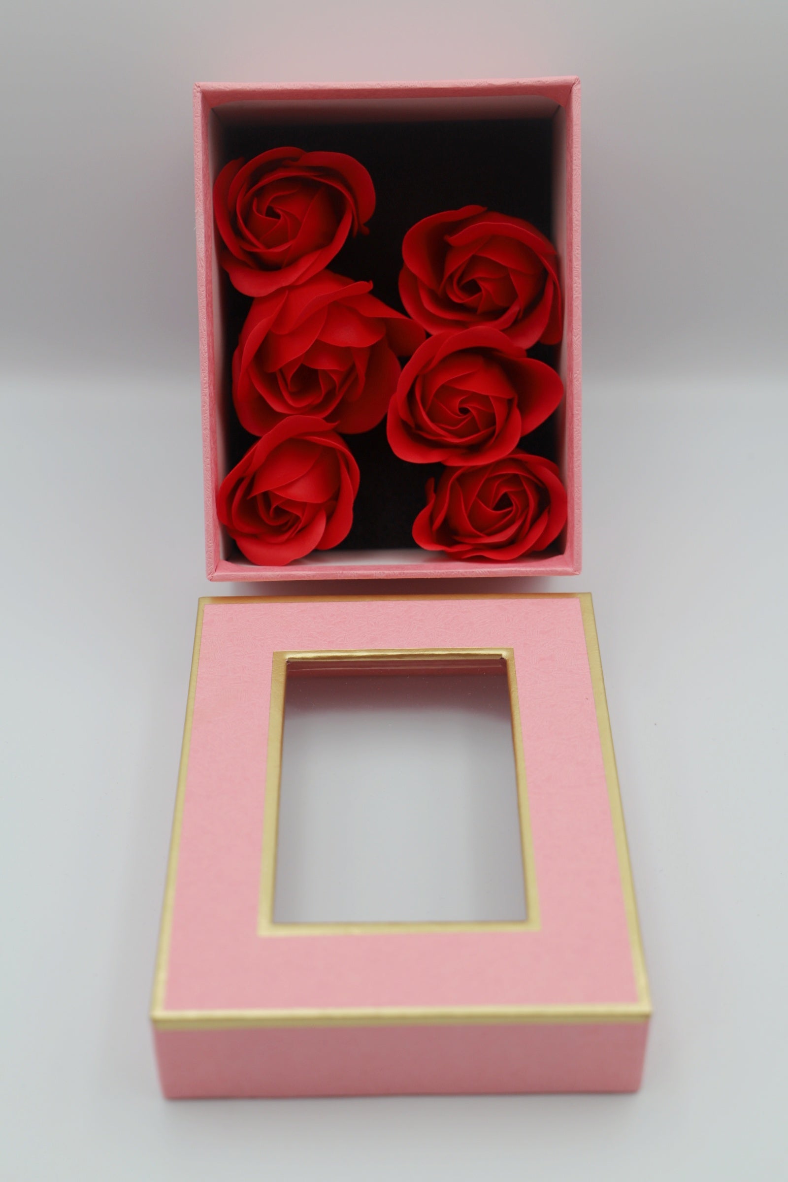 Pink gift box red petals